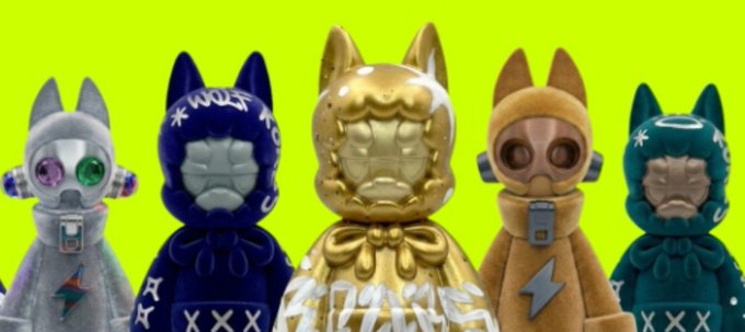 Five cartoonish cat-like figures in different colored hoodies (silver, blue, gold, tan, and teal) stand against a bright green background.