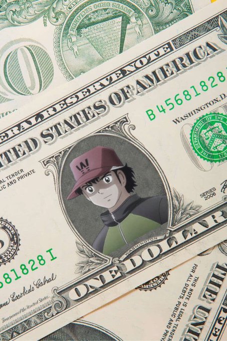 A close-up of a US one dollar bill featuring an anime-style character illustration in the portrait area.