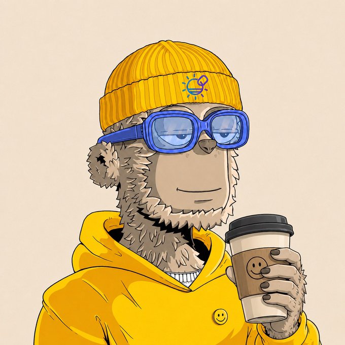 A cartoon bear character wears a yellow beanie with a small logo, blue-tinted sunglasses, and a matching yellow hoodie while sipping from a coffee cup, fitting the relaxed "Goodmorning, Happy TB Thursday" vibe of a cheerful morning post.