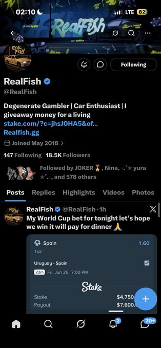 A Twitter profile page for "RealFish" (@RealFish) with 18.5K followers, showing a betting slip for Spain vs Uruguay on Fri Jun 26 with a $4,750 stake and $7,600 payout, and a recent post reading "My World Cup bet for tonight let's hope we win it will pay for dinner." The screenshot, shared with the reply "Thank you king Stake: mufasakinging," highlights a successful gambling bet that the original poster appears to be showcasing as evidence of their betting skill.