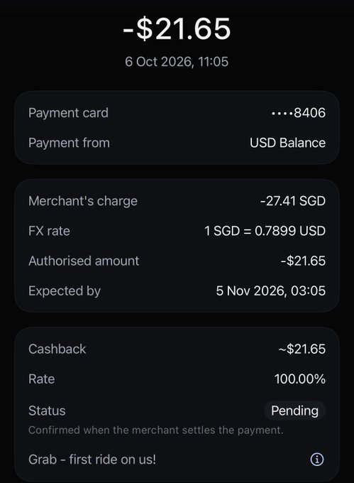 A dark-themed mobile payment confirmation screen showing a -$21.65 transaction from a payment card ending in 8406 on 6 Oct 2026, with a pending 100% cashback for a 'Grab – first ride on us!' promotion.