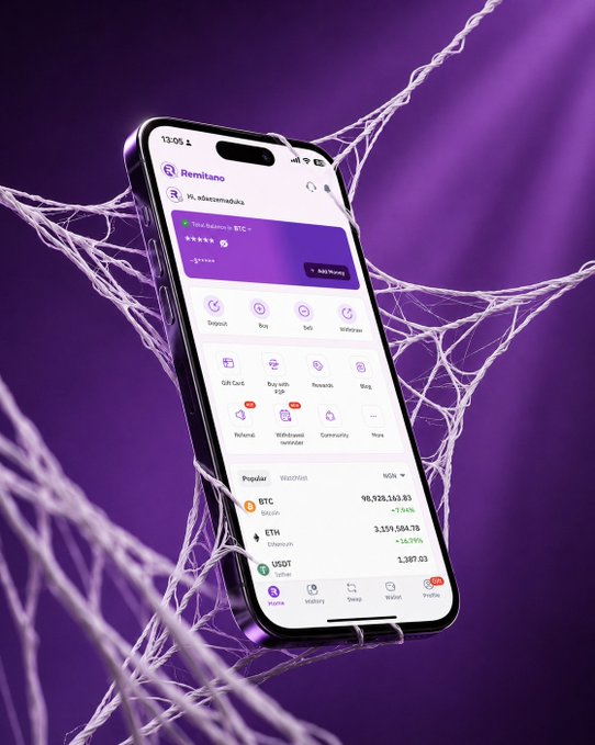 A promotional image shows the Remitano crypto exchange mobile app on an iPhone (time 13:05) against a purple background with spider web patterns, displaying a balance of 98,928,163.83 BTC (in satoshi) and featuring services like Swap, Buy, Sell, and Withdraw.