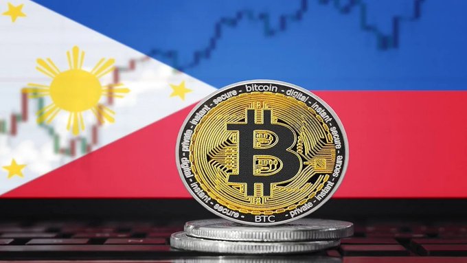 A physical Bitcoin coin stands on stacked coins with the Philippine flag in the background and a financial chart overlay, symbolizing cryptocurrency in the Philippines.