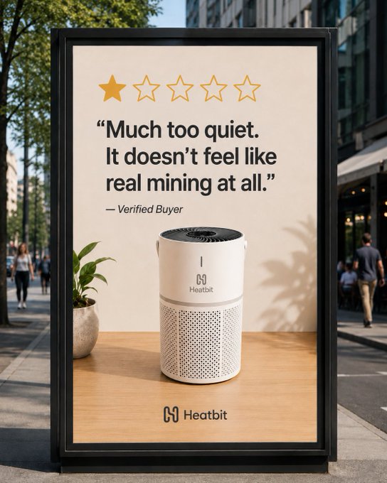 An outdoor billboard advertisement for "Heatbit" featuring a 1-star review that reads, "Much too quiet. It doesn't feel like real mining at all."