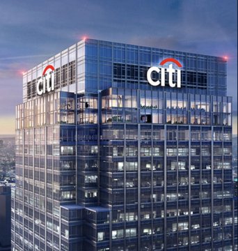 The Citi bank logo is displayed prominently on a glass skyscraper, with the recognizable "citi" text visible on multiple sides of the building. This image relates to the post's claim about a major bank raising its Bitcoin price target, as Citigroup is one of the world's largest financial institutions whose bullish stance on BTC is being highlighted.