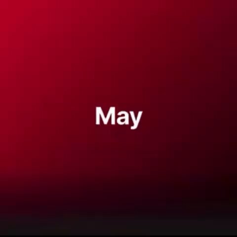 The image features a red background with white text that reads "May" at the top center. The text is in all capital letters, making it stand out against the dark red backdrop. The surrounding area appears to be black, which contrasts with the red color of the background and makes the white text more prominent.
