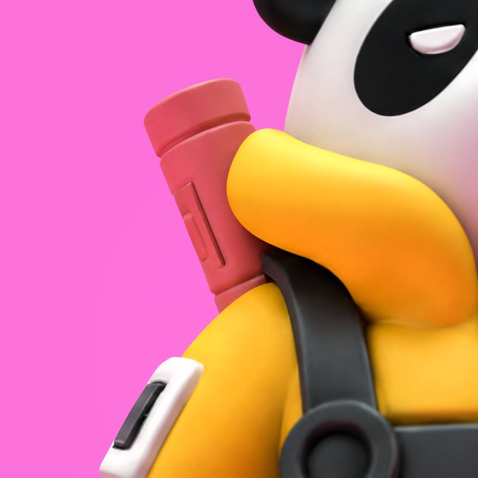 A close-up of a stylized 3D panda character with a yellow body, white face, and black eye patches, set against a vibrant pink background. The character appears to be wearing a backpack strap and holding a pink cylindrical object, fitting the playful, collectible aesthetic of Doodles' new factory-themed project.