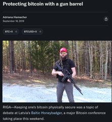 Article titled 'Protecting bitcoin with a gun barrel' by Adriana Hamacher (September 19, 2019), featuring a man holding a rifle, about keeping bitcoin physically secure at a Bitcoin Baltic Honeybadger conference.