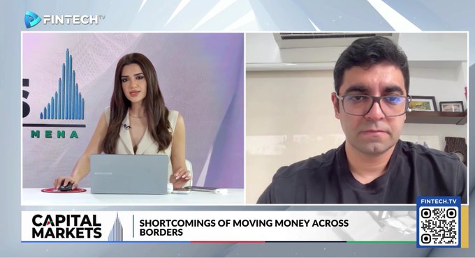 The image shows a split-screen interview on Fintech TV's "Capital Markets" segment, featuring a female anchor in the studio and a male guest (likely from ZIGChain) appearing remotely. The on-screen text reads "SHORTCOMINGS OF MOVING MONEY ACROSS BORDERS," setting the stage for a discussion that aligns with the post's message about bridging traditional finance and decentralized finance through ZIGChain's vision.