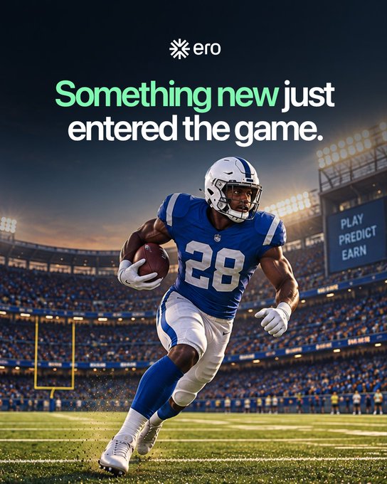 The image features a football player wearing a blue jersey with the number "28" running with the ball on a stadium field, accompanied by the text "ero - Something new just entered the game." A stadium sign reads "PLAY PREDICT EARN," tying into the post's message about using ero's prediction circuit to test new apps and earn rewards rather than just sharing football opinions in group chats.