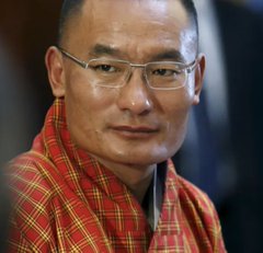A man wearing glasses and traditional Bhutanese dress appears serious against a blurred background. The image is paired with breaking news that Bhutan has sold over 90% of its Bitcoin reserves, dropping from 13,000 BTC to an estimated 1,200—a move the post labels a "historic mistake."