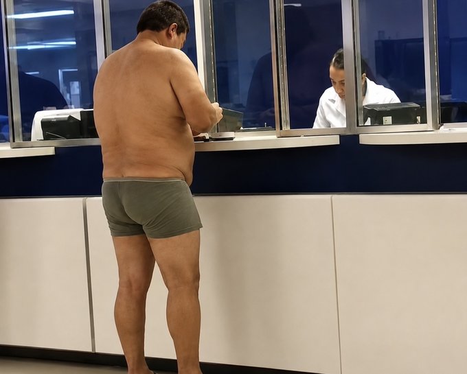 A man in only his underwear stands barefoot at a counter, embarrassed before a cashier, illustrating the humor of impulsively buying "one more dip" in the market at great personal cost.