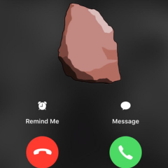 A smartphone lock screen displaying an incoming call screen with a potato as the contact image, showing options to 'Remind Me' or send a 'Message' along with red and green call buttons.