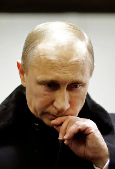 A contemplative Vladimir Putin is shown in close-up, with his hand resting against his lips in a pensive gesture. The image accompanies a report from the OSW Centre for Eastern Studies suggesting that Russian crypto regulation efforts are unlikely to succeed, as decentralized cryptocurrencies could evade oversight while targeted sanctions on Russia-linked assets remain a concern.
