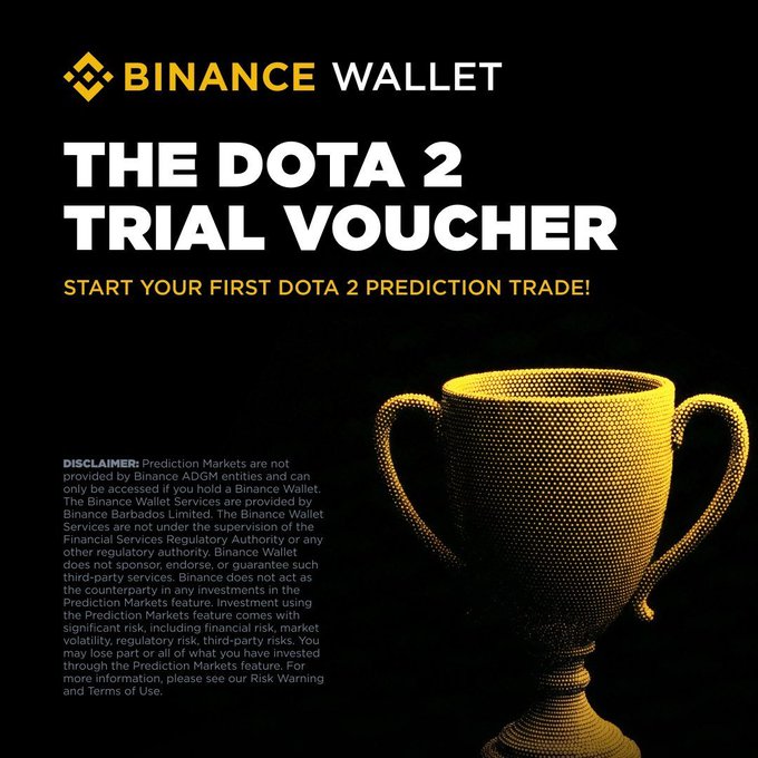 A black promotional graphic for Binance Wallet featuring 'THE DOTA 2 TRIAL VOUCHER' with the text 'START YOUR FIRST DOTA 2 PREDICTION TRADE!' and a gold trophy, alongside disclaimer text.