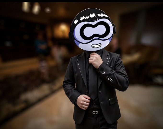 A masked figure in a sleek black suit with infinity-shaped clasps adjusts their tie, standing against a blurred lounge backdrop, symbolizing the sleek, high-tech innovation of Random Linear Network Coding (RLNC) that the post describes as revolutionizing blockchain data transmission.