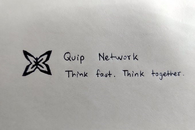 The image features a white piece of paper with black text that reads "quip network think fast. Think together." The text is written in a cursive font style, giving it an artistic touch. The message seems to be about promoting the idea of collaboration between different fields or areas of expertise, as seen in the context of the Quip Network project.