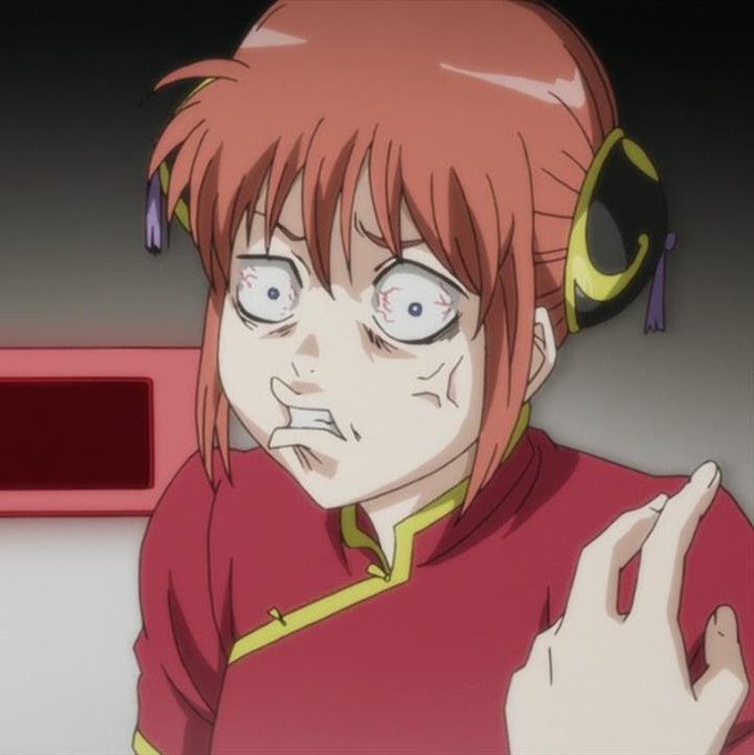 An anime character with red hair and an exhausted, distressed expression has wide bloodshot eyes, set against a dark background.