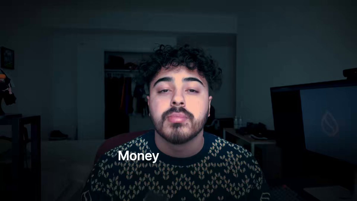 The image features a man with curly hair wearing a sweater, sitting in front of a TV screen that displays the word "money". The scene suggests an advertisement or promotional material related to money management or financial services.