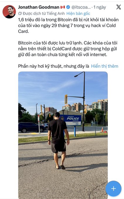A tweet in Vietnamese from Jonathan Goodman (@itscoaa...) explaining that $1.6 million in Bitcoin was withdrawn from his account on July 29 in a hack involving his ColdCard, with his private keys stored offline, accompanied by a photo of a man walking toward a police services building.