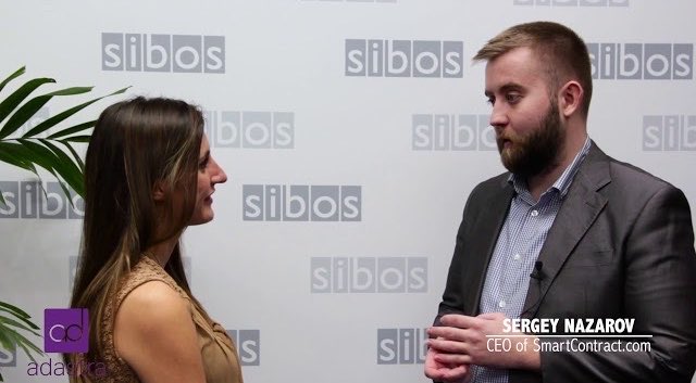 An interview at SIBOS featuring Sergey Nazarov, CEO of SmartContract.com, speaking with a female interviewer, with 'adavoice' branding visible in the corner.