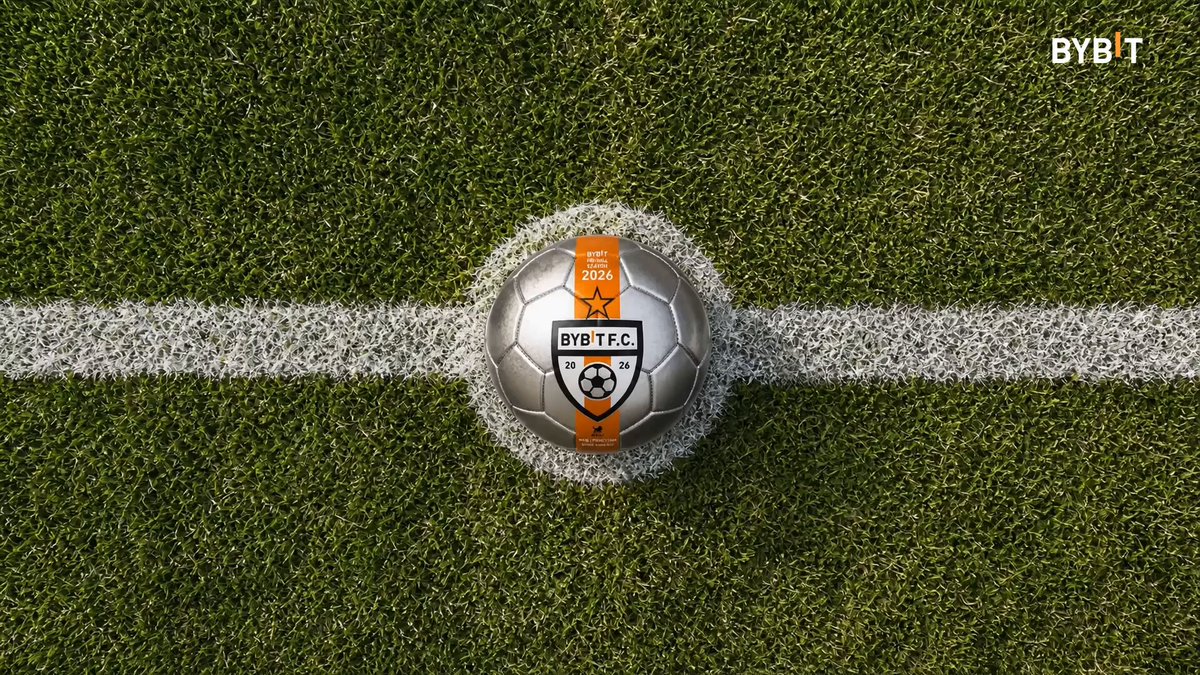 The image displays a soccer ball sitting at the bottom right side of an advertisement for Bybit Football Season. The soccer ball has a silver color, and its position emphasizes the connection between the advertised event and the sports-related product. The surrounding area appears to be a green soccer field with white boundary lines, likely representing the sport's rules or boundaries. This unique placement of the ball in the image could attract viewers' attention and generate interest in both the soccer game and Bybit Football Season.