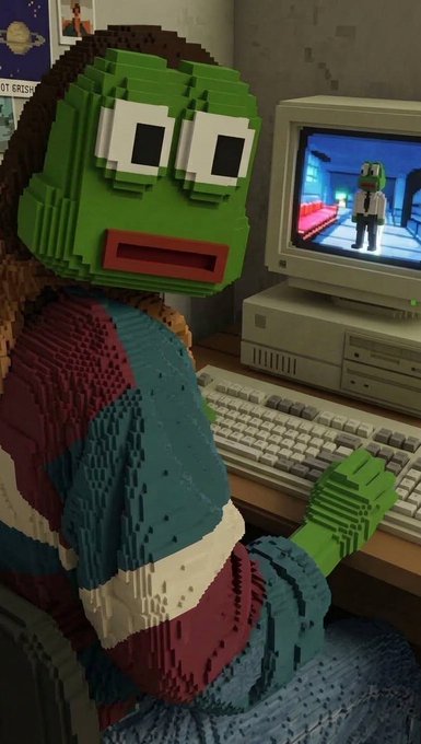 A 3D LEGO-style sculpture of a green-faced figure wearing glasses and a striped sweater, seated at an old desktop computer displaying its own image on the monitor.