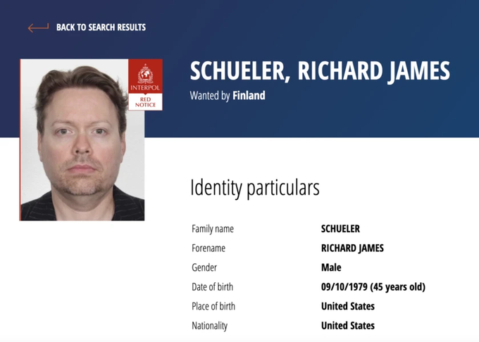 An Interpol Red Notice image shows Richard James Schueler, a 45-year-old American male born on 09/10/1979, wanted by Finland. The accompanying post suggests he was caught for tax evasion with no other official charges noted.