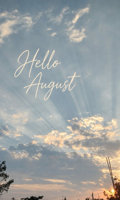 An aesthetic 'Hello August' greeting card featuring a scenic sky with sun rays bursting through scattered clouds at sunset.