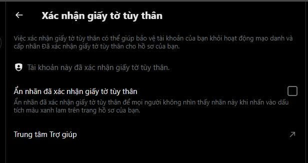 A dark-themed interface shows the "Xác nhận giấy tờ tùy thân" (Identity Verification) settings page in Vietnamese, confirming that the account has already verified its identity documents, with an option to hide the verified badge. This relates to the post's advice about completing personal document verification during X account setup to confirm account authenticity.
