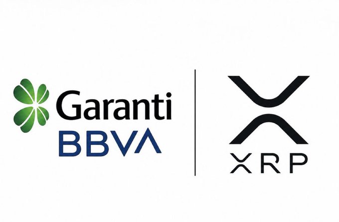 The image features two logos side by side - one for Garanti BBVA bank located in Turkey and another for Ripple cryptocurrency exchange. The logos are positioned next to each other, with the Garanti logo being slightly larger than the Ripple logo. Both logos have a white background, making them stand out against the grayish-white color of the image. The text "One of Turkey's largest banks, Garanti BBVA" is written in black at the bottom of the image, and the phrase "Another example of major financial institutions leveraging blockchain technology to improve speed, efficiency, and global money movement." is also present on the image.