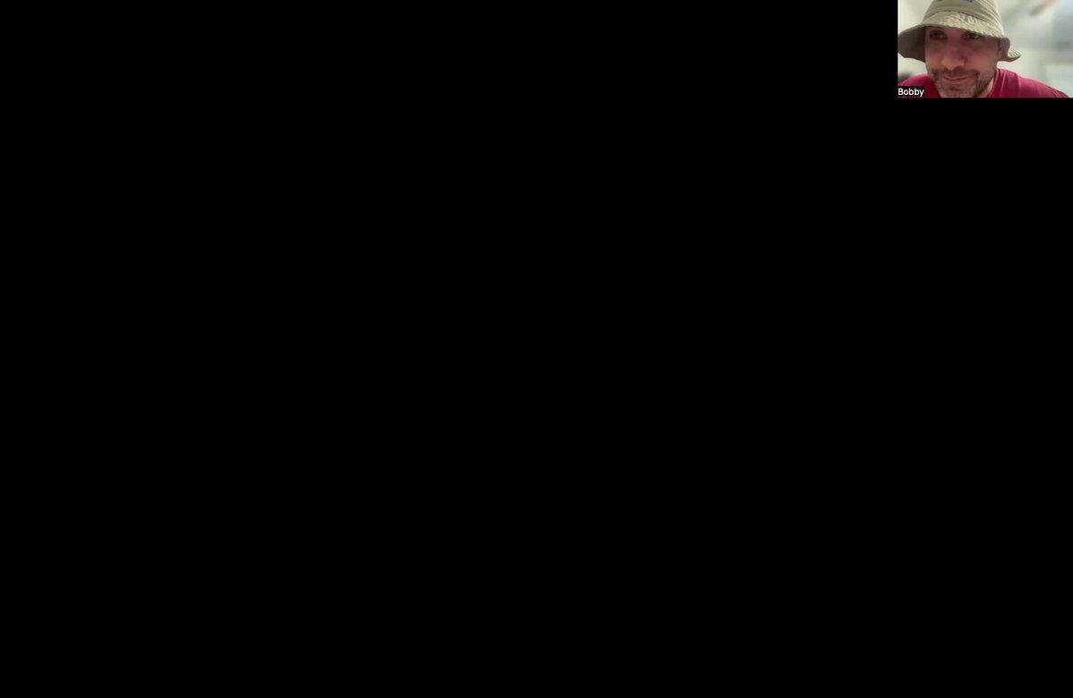 The image shows a man wearing a hat with his face partially visible behind a screen. The background of the image is black, which contrasts with the white text that reads "THE CHARLES HOSKINSON FILES: A Cautionary Tale about Flying too Close to the Sun Private jet, Blackhawk helicopter, numerous business ventures, AND more... $ICP $ADA $CLOUD". This suggests a cautionary tale or warning related to flying at high altitudes and being exposed to the sun's harmful rays.

The man in the image appears to be wearing a hat with a wide brim, which could provide some protection against the sun. The caption also mentions that there is an abundance of text on the screen, possibly providing additional information or context about the cautionary tale.