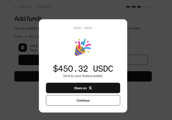 A mobile app interface screenshot showing a 'PAYBOX - CONNECT' screen with a pop-up modal celebrating a 'USDC DROP' of '$450.32 USDC' meant to be sent to a Solana wallet, featuring a colorful party popper emoji.