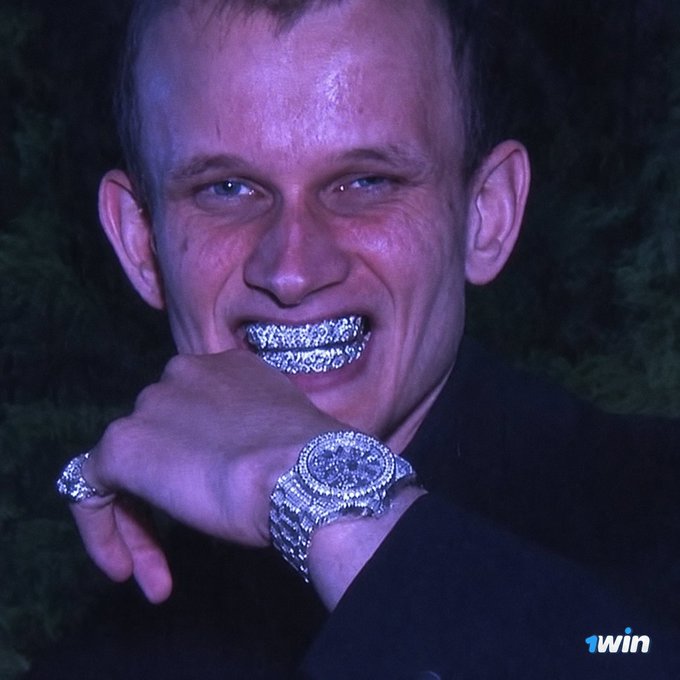 A man showing off diamond-encrusted grillz, a large diamond watch, and a diamond ring, with a '1win' logo in the corner.