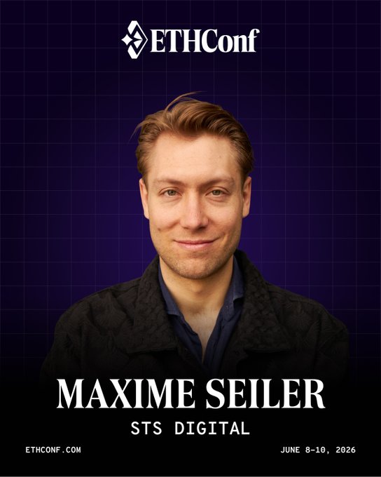 The image features an advertisement for an event called "ETHConf" that took place from June 8-10, 2019. The poster showcases a man wearing a black jacket with a smiley face on his face. The text on the poster indicates that the event was held in New York City and that it focused on trading volatility at Credit Suisse and a major vol hedge fund before co-founding STS in 2019. The poster also mentions that the event took place in June, which is the same date as the release of the new STS digital platform.