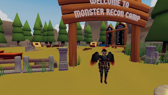 A 3D video game scene displays a character with red wings and a horned helmet standing under a wooden archway sign that reads "WELCOME TO MONSTER RECON CAMP."