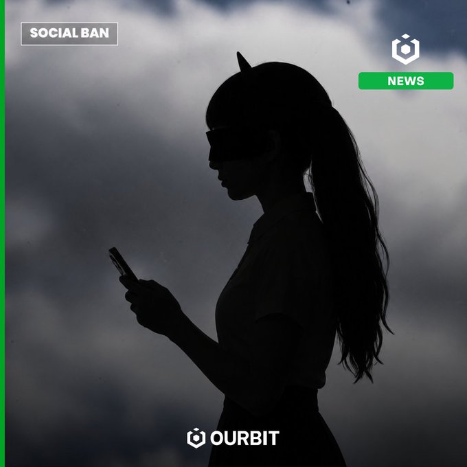 A silhouetted figure wearing cat-ear headphones and a face mask looks down at a smartphone against a moody, cloudy sky, overlaid with a "SOCIAL BAN" tag, a "NEWS" badge, and the "OURBIT" logo—visually evoking the kind of impulsive, distraction-driven decision-making that ties into the post's playful prompt about what a financially carefree 13-year-old would buy with $100.