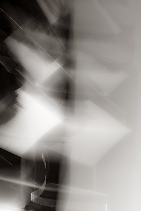In the image, there's a large black and white photograph with abstract shapes and lines scattered across its surface. The piece appears to be a result of scanning multiple photos into one or creating an effect that makes the individual images appear separate yet combined in a single composition. The caption on the post refers to this artwork as "a picture from Lisbon", which indicates that it might have been created by someone from Lisbon or is inspired by urban elements such as cityscapes, architecture, and transportation systems. The artist's name, @ExchangeArt, has also been mentioned in the description of the image, further reinforcing the connection to a specific location or creative endeavor.