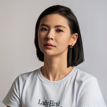 Bitget CEO Gracy Chen wears a "Lady First" t-shirt in a professional headshot, paired with her recent statement expressing pessimism about recovering funds from the exchange's breach, citing the low 3.5% recovery rate from the 2025 Bybit hack as precedent.