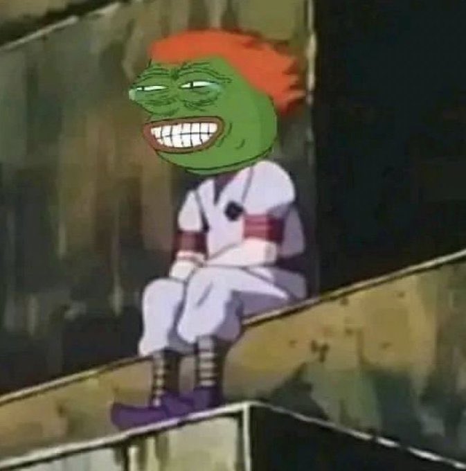 Meme image combining the Pepe the Frog face with orange anime-style hair onto a body wearing a white outfit with red armbands, sitting on a ledge.
