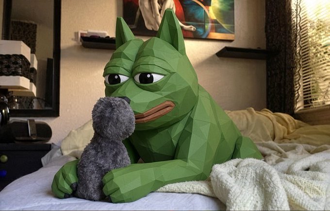 A low-poly 3D rendered green frog-like character with pointed ears and a tired expression sits on a bed holding a small gray stuffed animal in its lap.