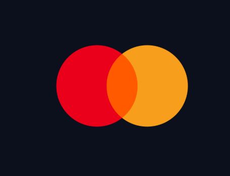 The image features a logo for Mastercard, which consists of two circles with different colors - red and yellow. The red circle has a white border, while the yellow circle does not. The text "MASTERCARD RECEIVE CRYPTO LICSENCE!" is written below the logo, indicating that Mastercard has recently secured a New York BitLicense to operate crypto services in NYC.