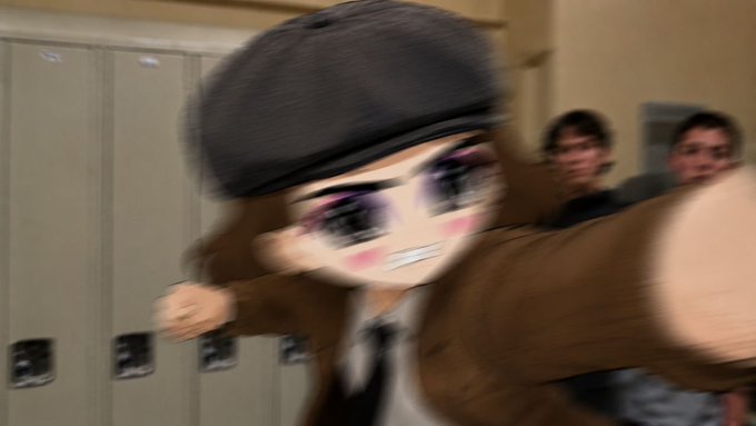 The image shows a blurry, motion-filled scene in what appears to be a school hallway with lockers, featuring a digitally edited character with oversized anime-style eyes, a beret, and dramatic makeup wearing a brown outfit, with two real people visible in the background. The motion blur and chaotic composition give it the appearance of AI-generated or heavily manipulated content, fitting the post's skepticism about whether the image is authentic.
