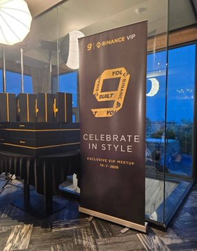 A promotional banner for a 'BINANCE VIP EXCLUSIVE VIP MEETUP' on Feb 7, 2026, with the text 'CELEBRATE IN STYLE' and a stylized 'B' logo, displayed in an indoor venue with large windows.