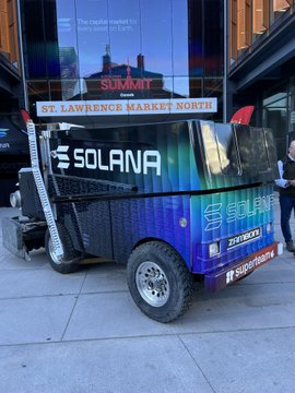 A trailer branded with the Solana logo and colorful graphics parked outside St. Lawrence Market North, promoting a crypto market activation.