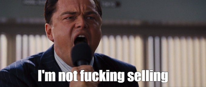 A movie still of Leonardo DiCaprio yelling into a microphone with the caption 'I'm not fucking selling'.