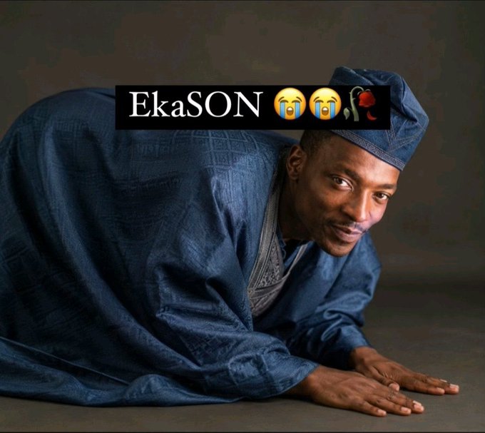 A man in traditional blue Nigerian attire kneels on the ground in a posture of surrender, overlaid with the text "EkaSON 😭😭🥀." The image humorously conveys the poster's regret for mocking someone who said $ANSEM wouldn't cross $0.5, now expressing defeat as that prediction proved wrong.