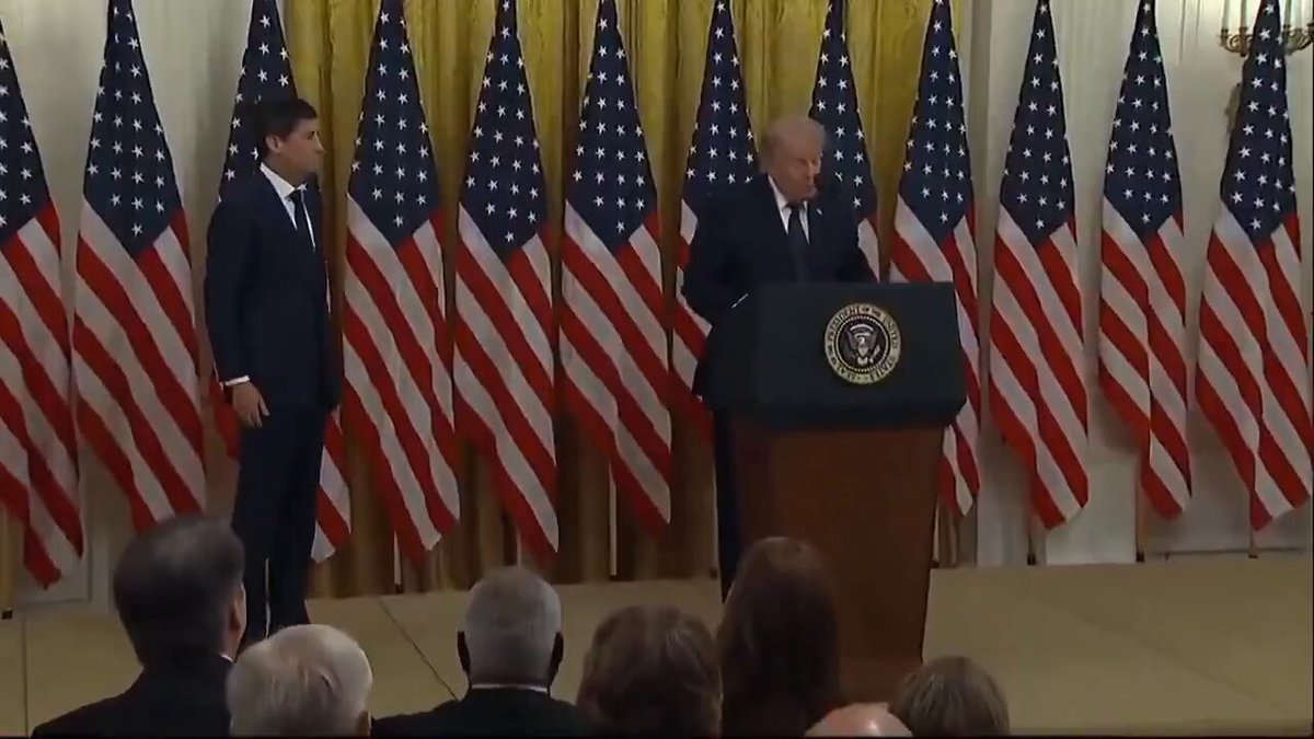 The image shows a man giving a speech at a podium, with an audience of people watching him. The man appears to be delivering a speech related to Bitcoin or cryptocurrency, as suggested by the title "BREAKING Kevin Warsh has officially been sworn in as the new Fed Chair Everyone expected Bitcoin to pump. Instead... BTC dropped. The market just proved one thing: "Buy the rumor. Sell the news." Bull trap or buying opportunity?".