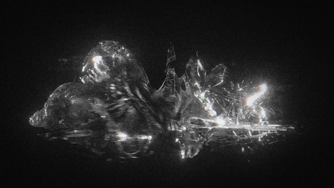 A dark, ethereal black and white photograph of what appears to be a translucent, glass-like creature or sculpture with bright highlights, set against a black background with reflections.
