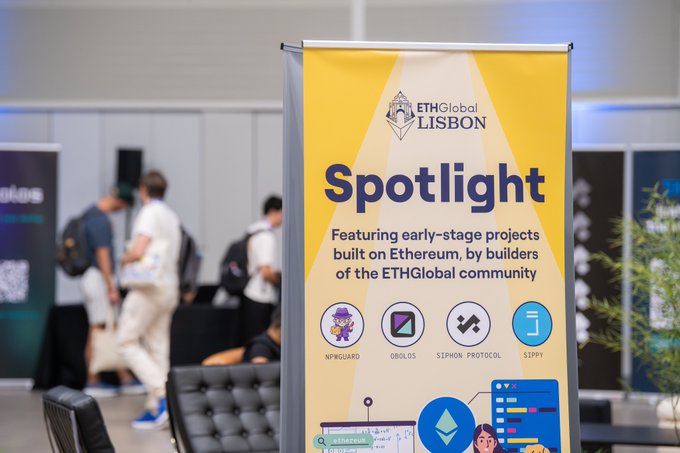 A yellow promotional banner for "ETHGlobal LISBON" advertises a "Spotlight" area featuring early-stage Ethereum projects built by the community, including NPRGUARD, OBOLUS, SIPHON PROTOCOL, and SIPPY.
